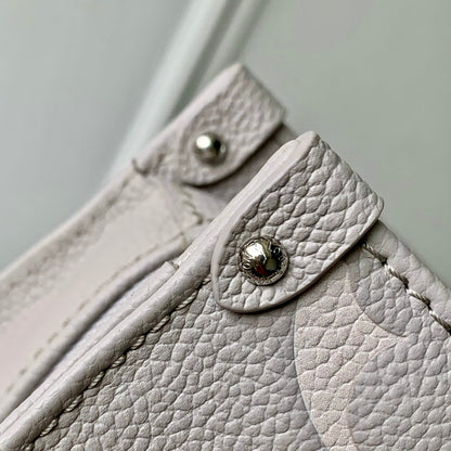 ONTHEGO EAST WEST BAG 25 IN BICOLOR MONOGRAM EMPREINTE LEATHER
